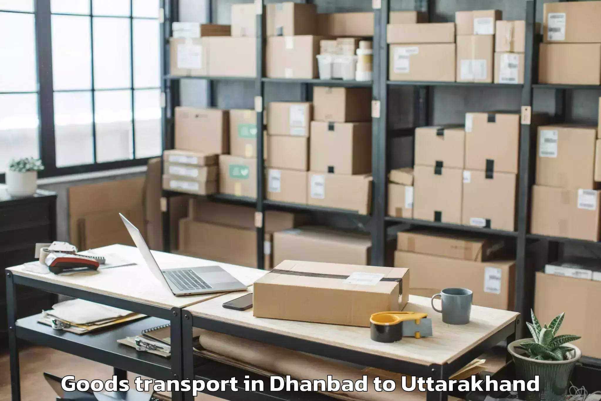 Easy Dhanbad to Banbasa Goods Transport Booking